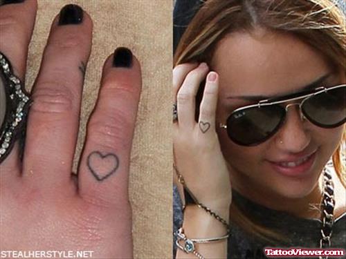 Miley Cyrus With Tiny Heart Finger Tattoo