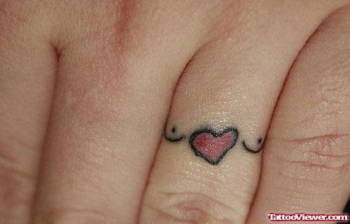 Beautiful Tiny Red Heart Finger Tattoo