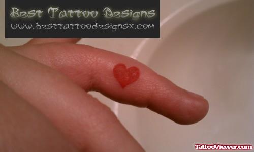 Amazing Tiny Red Heart Finger Tattoo