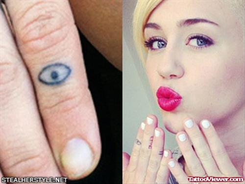 Miley Cyrus With Eye Finger Tattoo