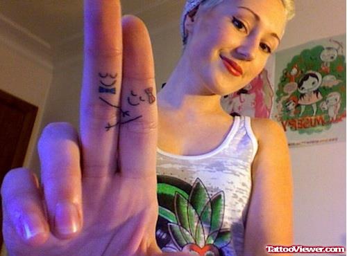 Girl With smiley Finger Tattoos