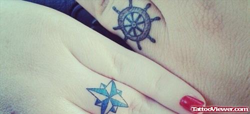Blue Nautical Star And Wheel Stering Finger Tattoos