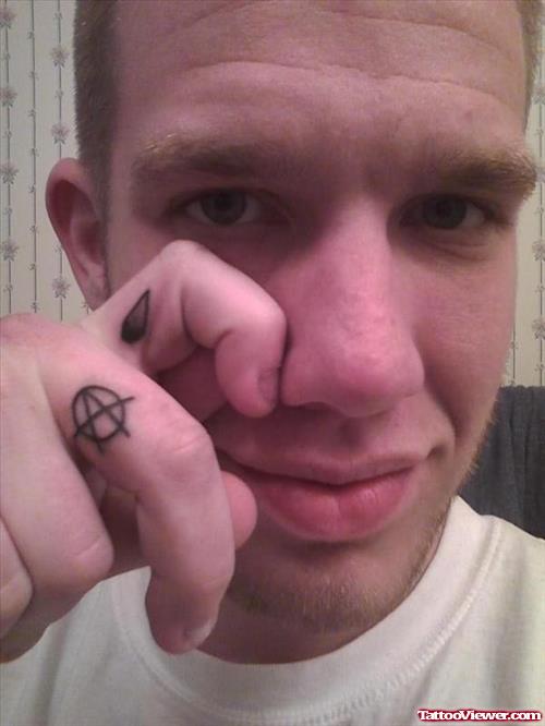 Grey Ink Tear Drop Finger Tattoo
