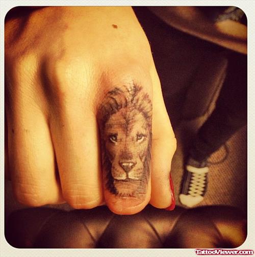 Grey Ink Lion Head Finger Tattoo