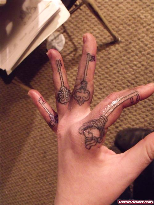 Grey Ink Keys Finger Tattoos