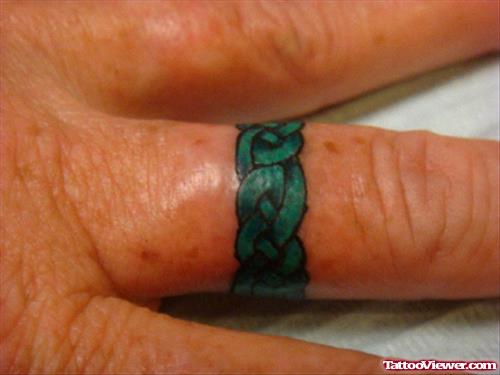 Green Ink Celtic Finger Tattoo