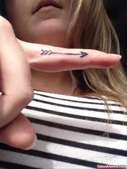 Black Ink Arrow Finger Tattoo