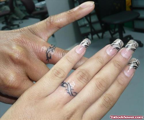 Black Ink Tribal Ring Finger Tattoos For Girls