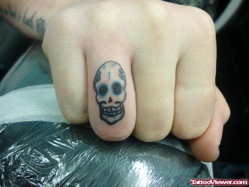 Black Ink Skull Finger Tattoo