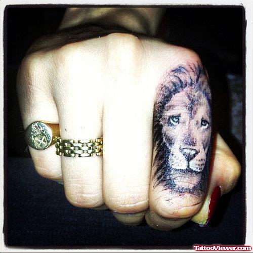 Attractive Lion Head Finger Tattoo