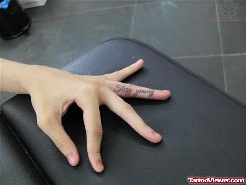 Stay Young Tattoo on Finger