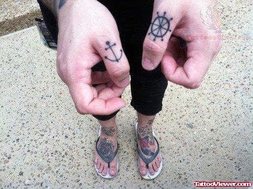 Compass And Anchor Tattoo On Fingers