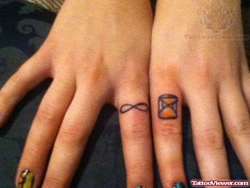 Infinity and Hourglass Tattoo On Fingers
