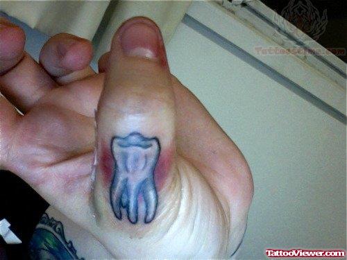 Teeth Tattoo On Thumb