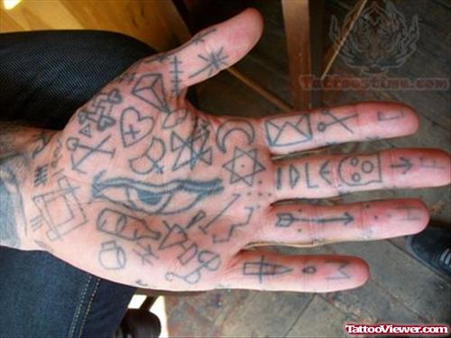 Symbols Tattoos On Hand And Fingers