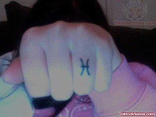 H Ring Tattoo On Finger