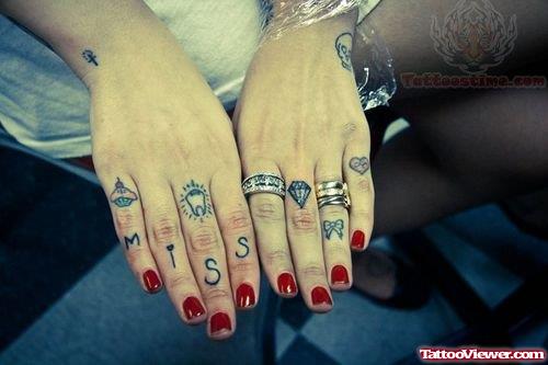 Bow And Miss Tattoo On Fingers
