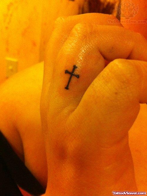 Tiny Finger Cross Tattoo