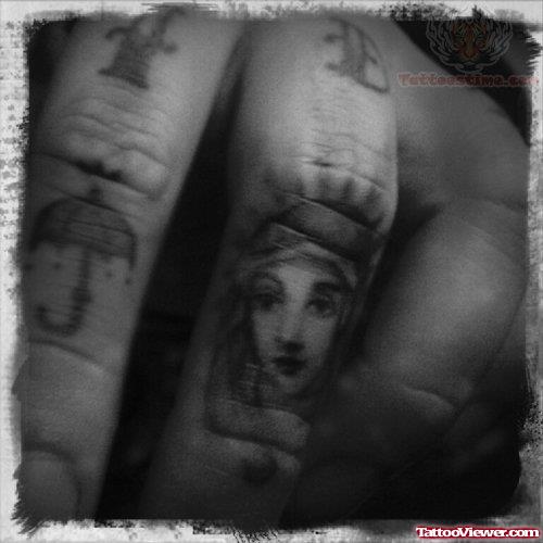 Mary Portrait Tattoo On finger