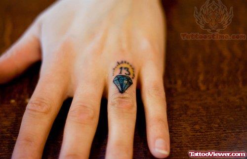 Blue Diamond Tattoo On Finger