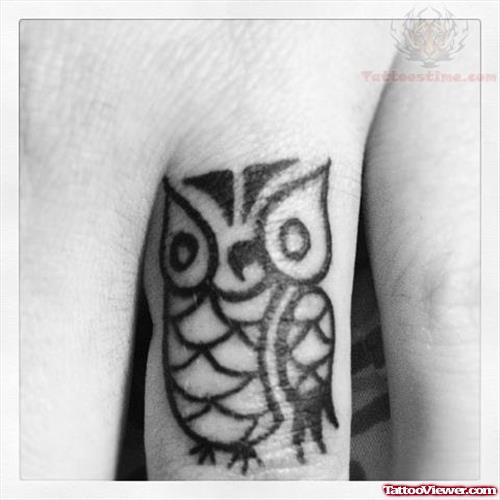 Black Tiny Owl Tattoo On Finger