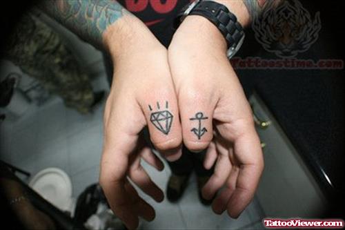 Diamond And Anchor Tattoo On Thumbs