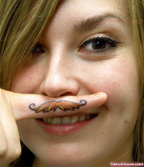 Color Mustache Tattoo On Girl Finger