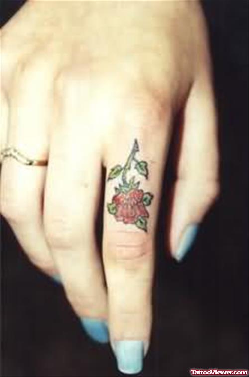 Scanty Rose Tattoo On Finger