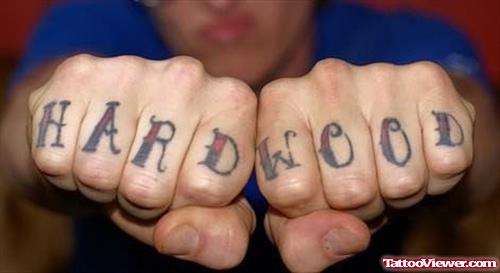 Hardwood Words Tattoo On Fingers