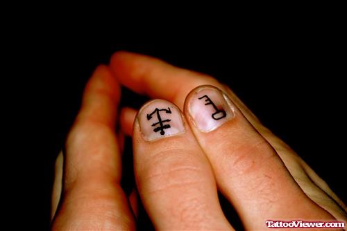 Anchor And Key Tattoo On Thumb Tip