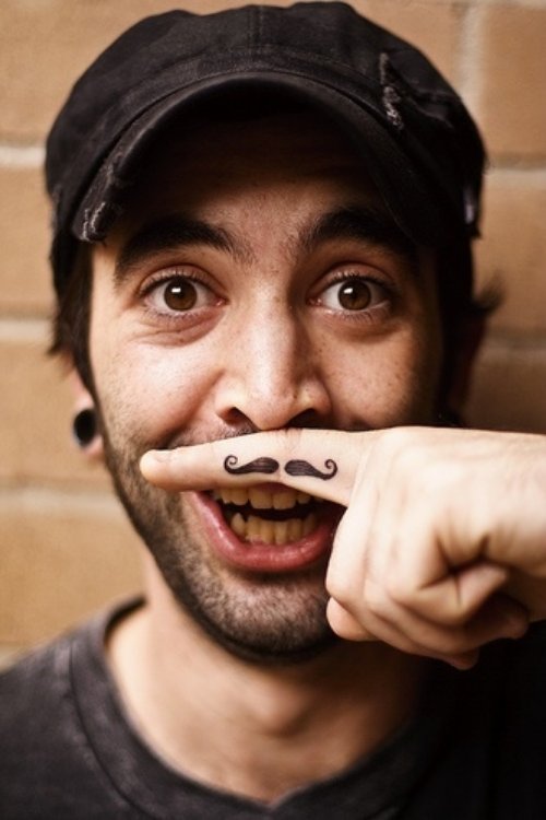 Guy With Mustache Finger Tattoo