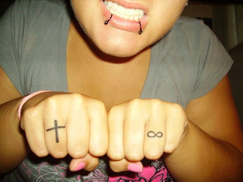Beautiful Girl Showing Her Finger Tattoos