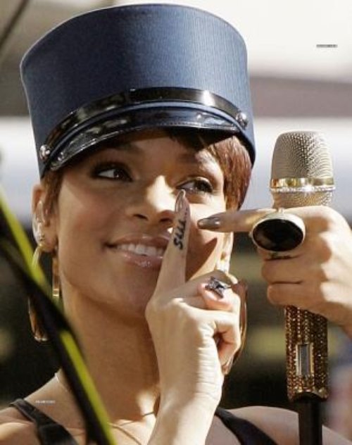 Rihanna Showing Shhh Finger Tattoo
