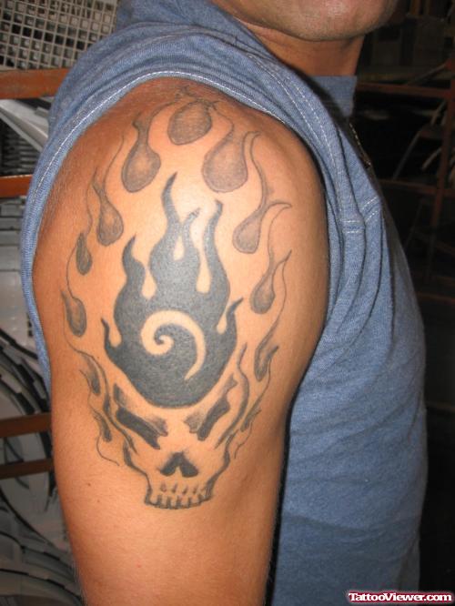 Grey Ink Skull With Fire And Flames Tattoo On Shoulder