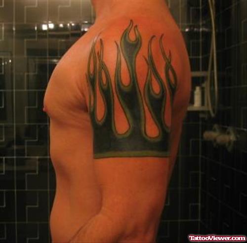 Green And Black Ink Fire and Flame Tattoo On Left Shoulder