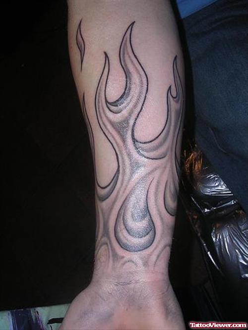 Grey Ink Fire and Flame Tattoo On Wrist