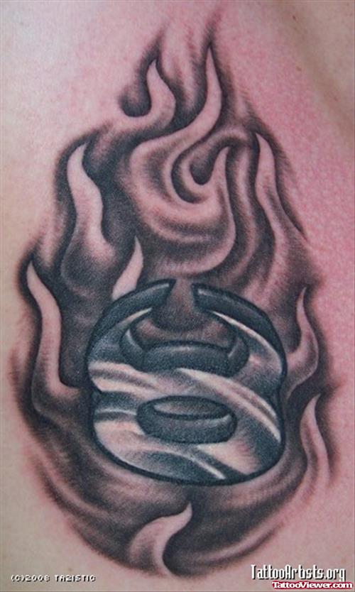 Grey Ink Taurus Zodiac Symbol In Flames Tattoo