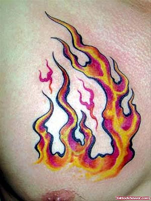Color Fire And Flame Tattoo On Man Chest
