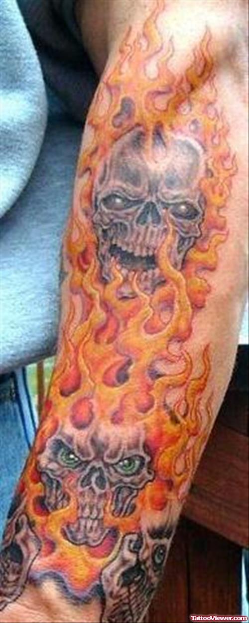 Skulls And Fire Flame Tattoo On Left Sleeve