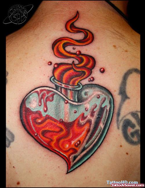 Flaming Heart Tattoo On Upperback