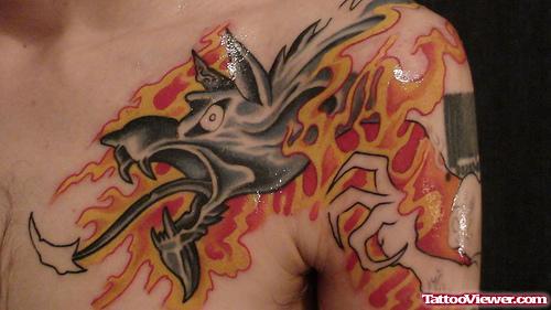 Dog Skull In Flame Tattoo On Left Shoulder
