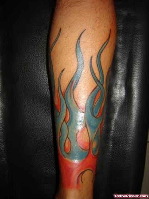 Amazing Colored Fire And Flame Tattoo On Sleeve