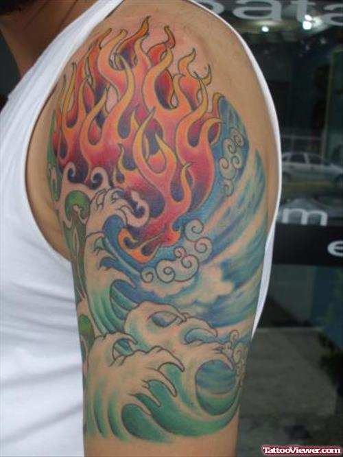 Water Waves And Colored Flames Tattoo On Left Half Sleeve