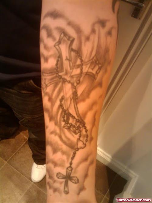 Grey Ink Cross In Fire And Flame Tattoo On Sleeve