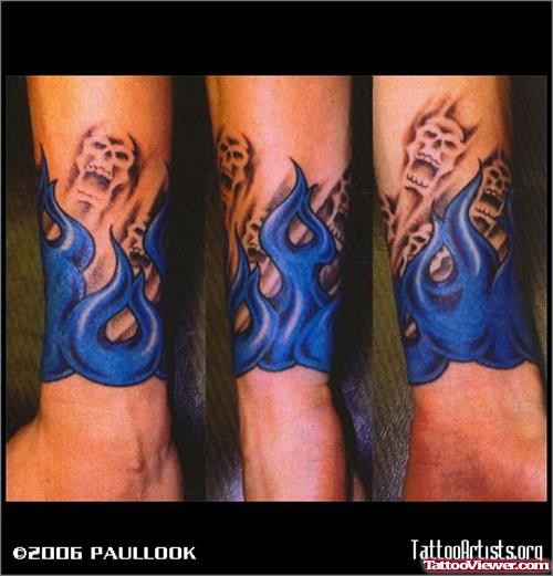 Blue Ink Flames Tattoo On Arm