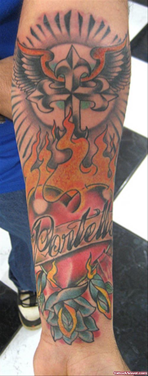 Winged Cross And Flaming Heart Tattoo On Left Forearm