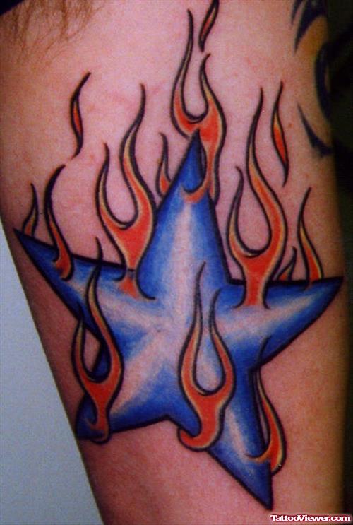 Flaming Blue Star Tattoo On Bicep