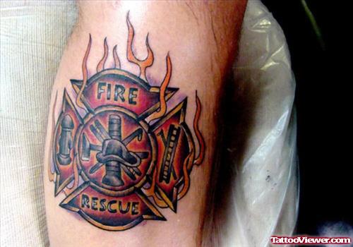 Firefighter Logo In Flames Tattoo On Leg