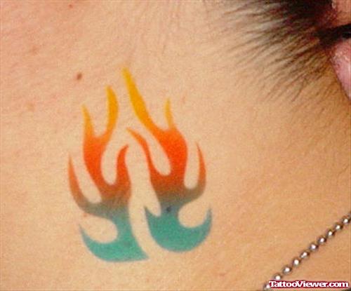 Colored Tribal Fire and Flame Tattoo On Side