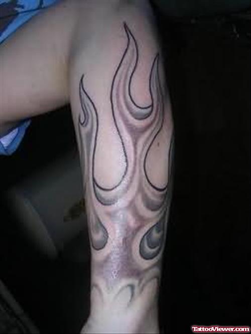 Grey Ink Fire and Flame Tattoo On Arm